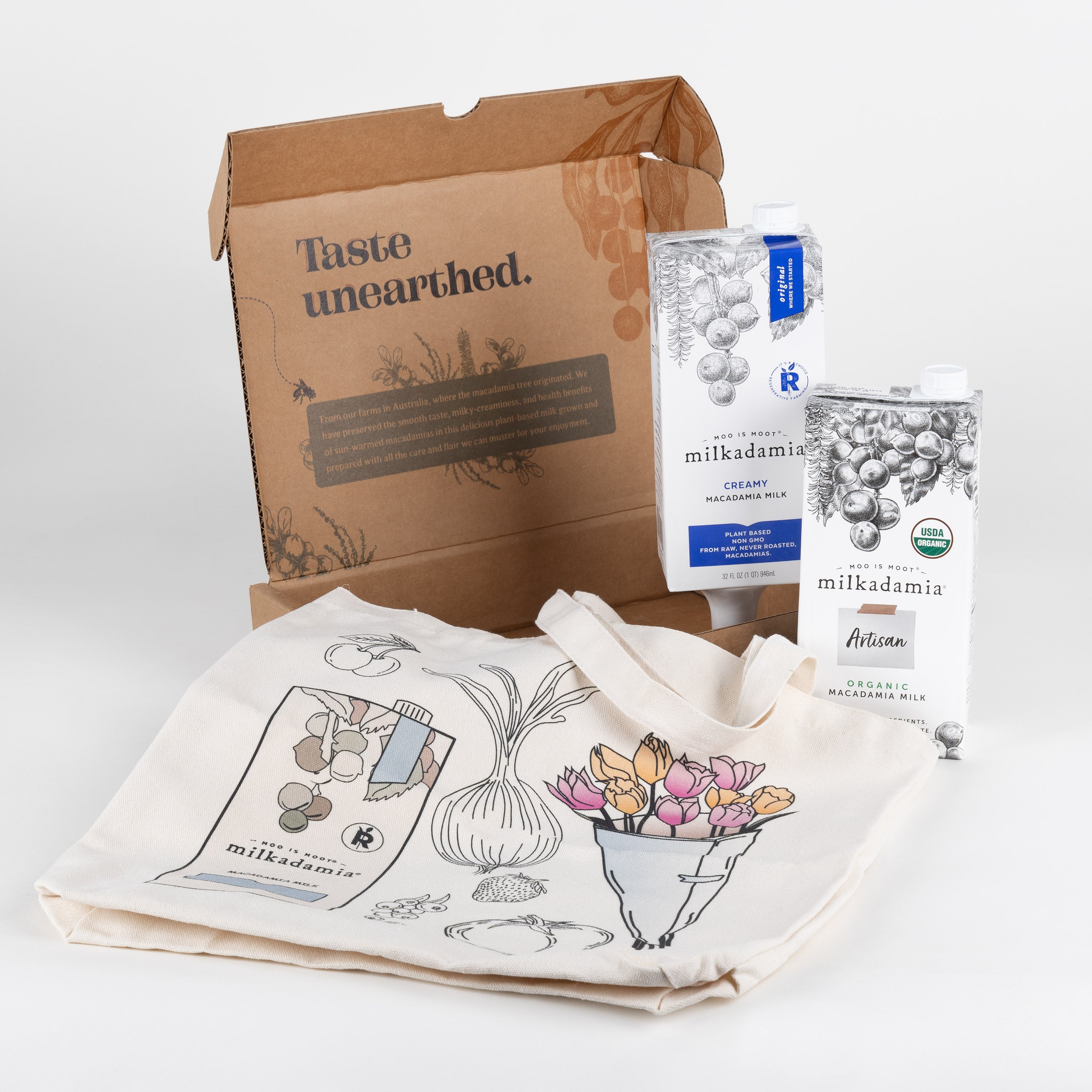 Milkadamia sweet holiday gift box with its contents laid out for full view